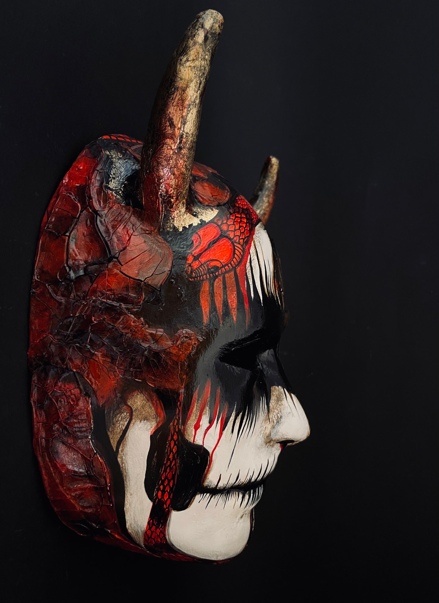 Demon mask with snakes