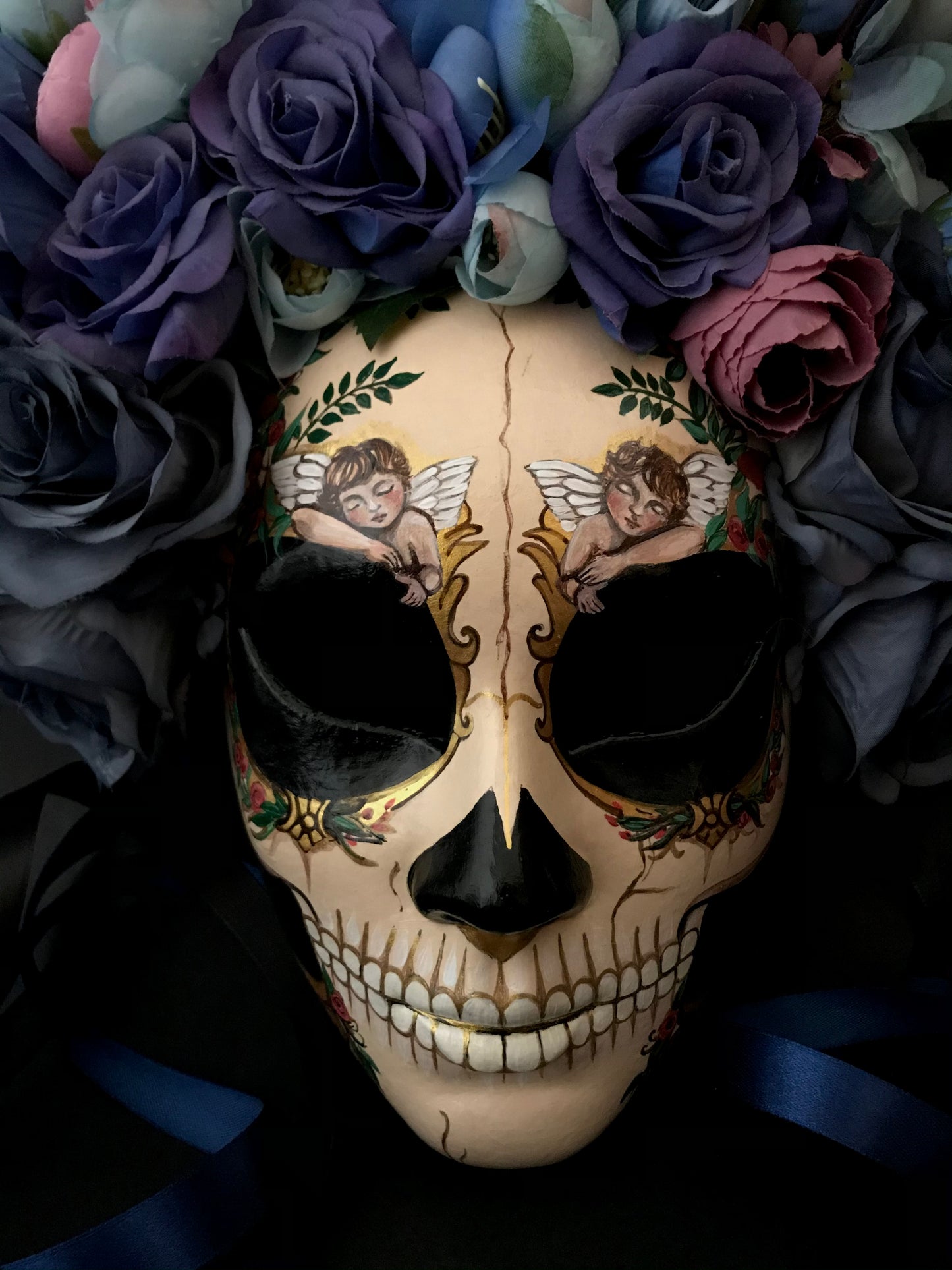 Catrina mask with sleeping angels