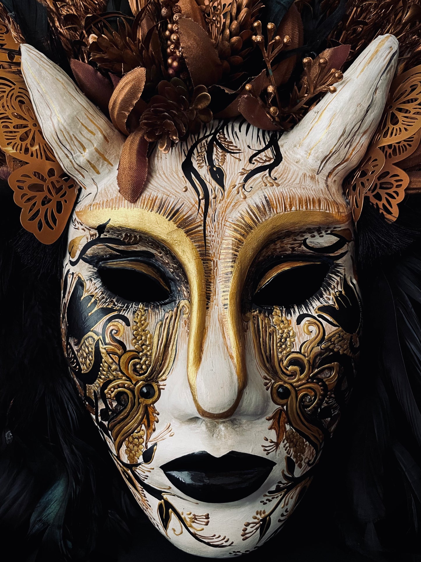 Demon mask with feathers. Masquerade mask