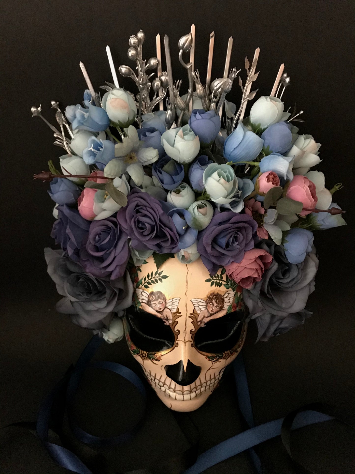 Catrina mask with sleeping angels