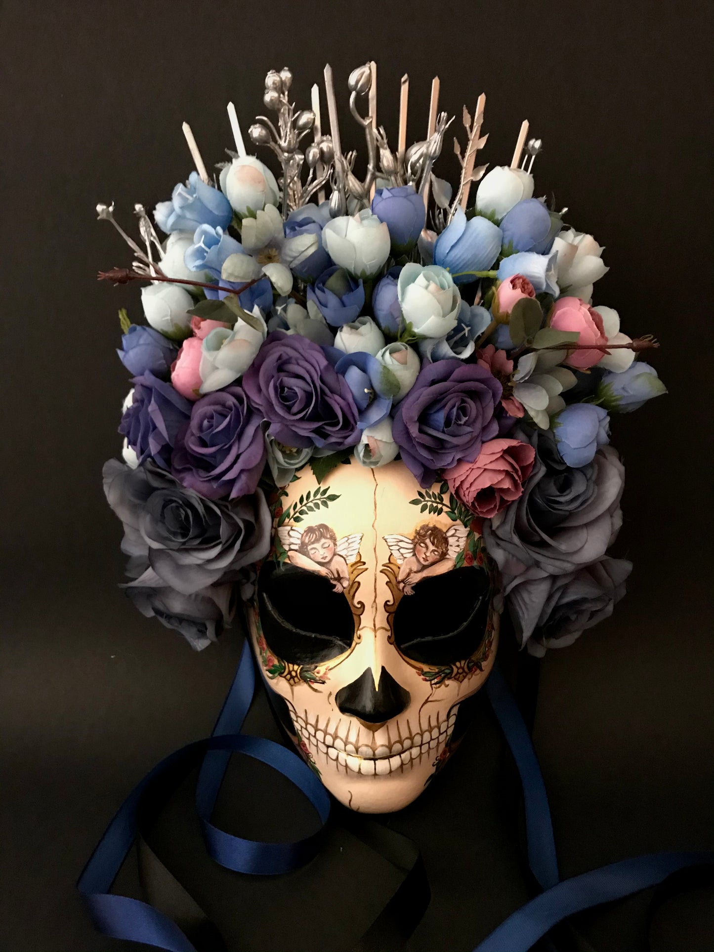 Catrina mask with sleeping angels