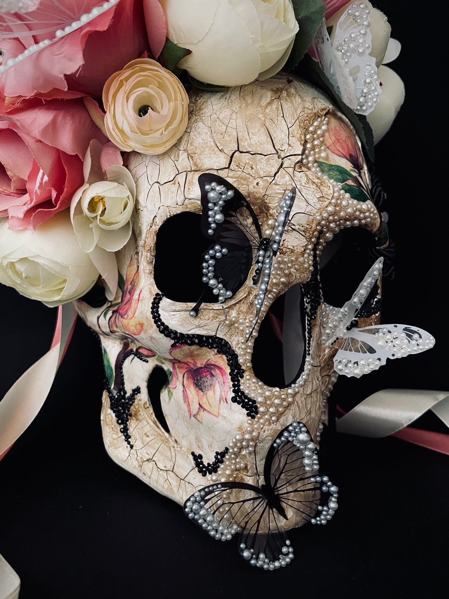 White Santa Muerte mask. Skull mask with butterflies