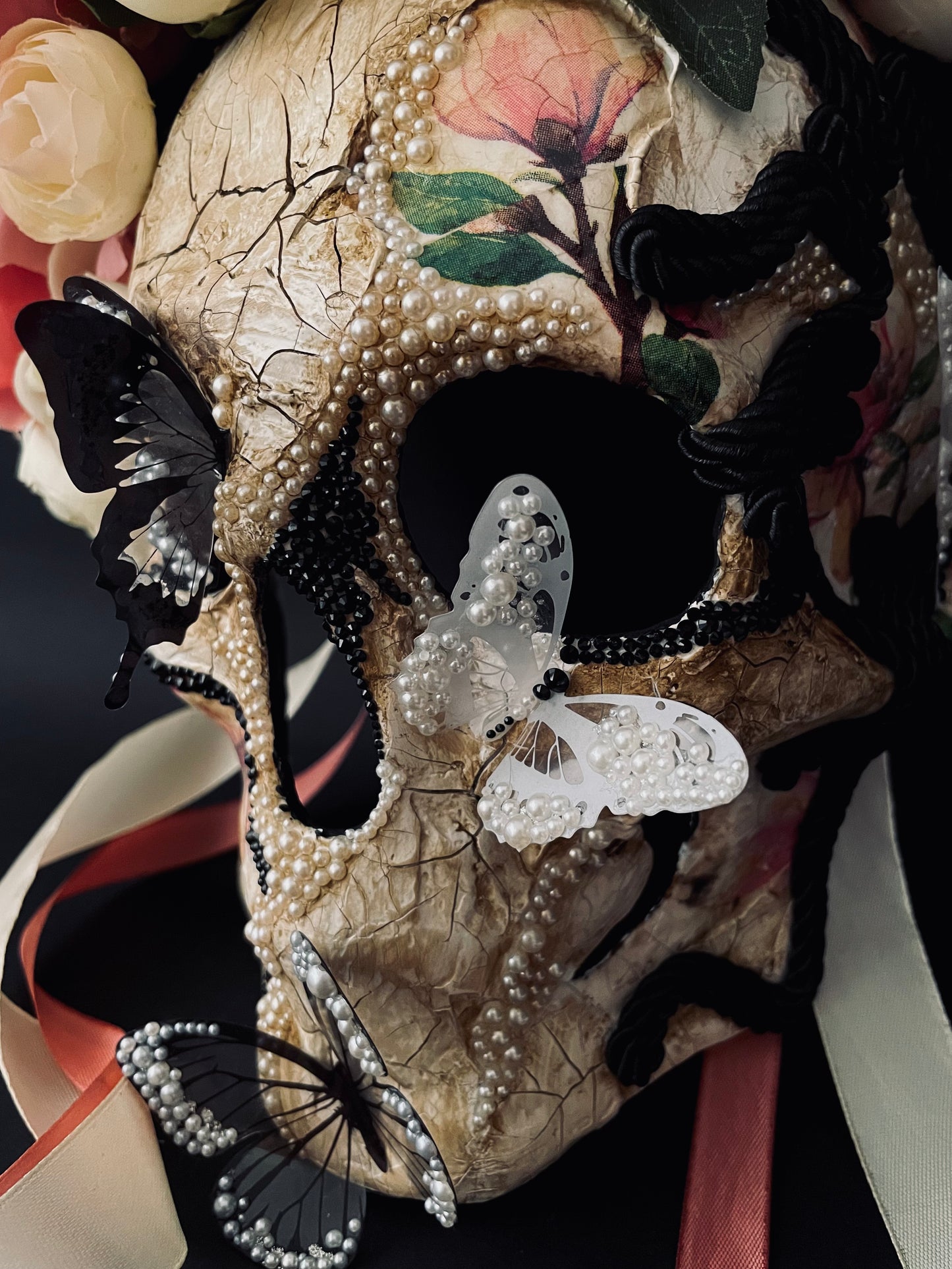 White Santa Muerte mask. Skull mask with butterflies