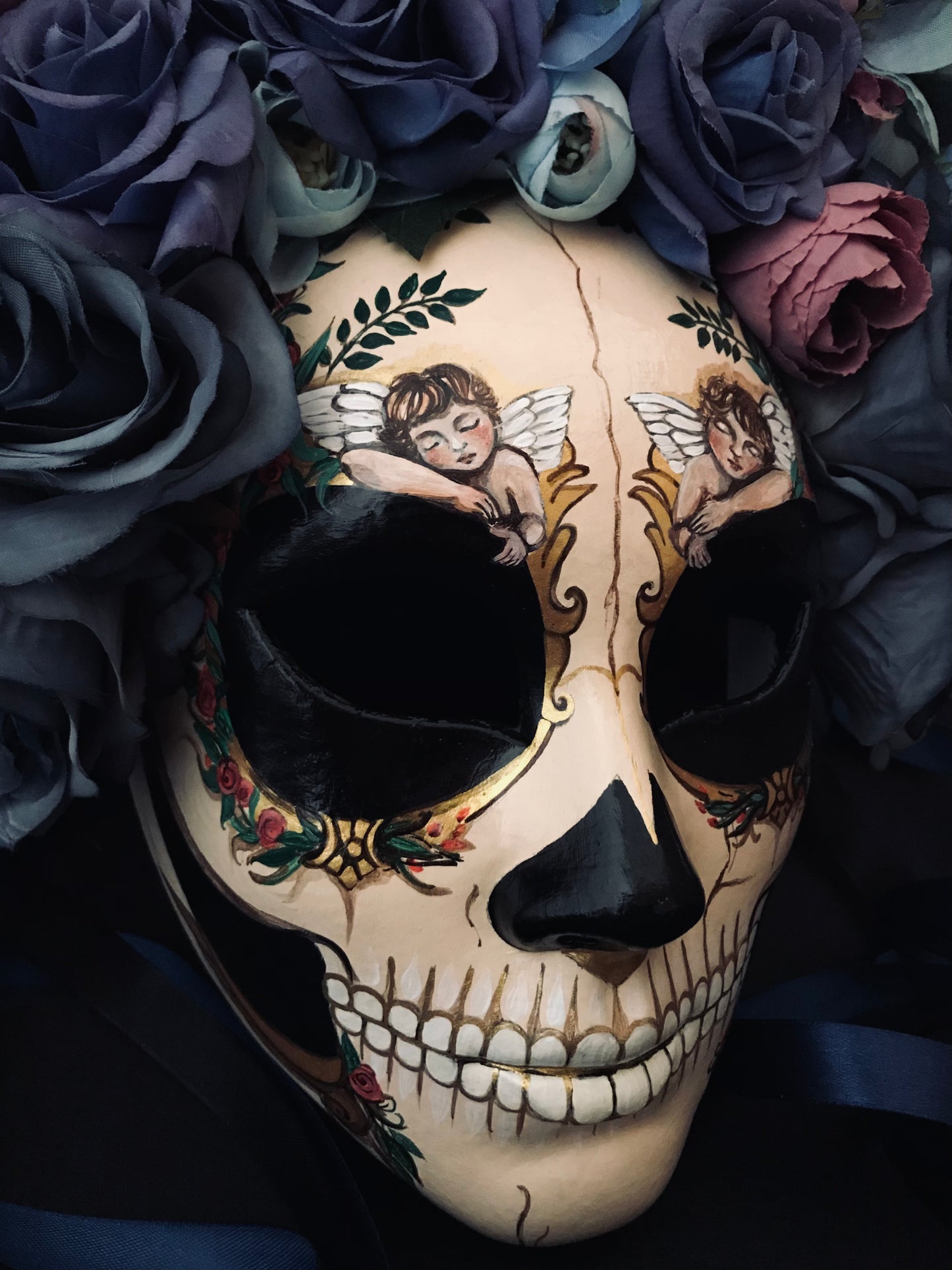 Catrina mask with sleeping angels