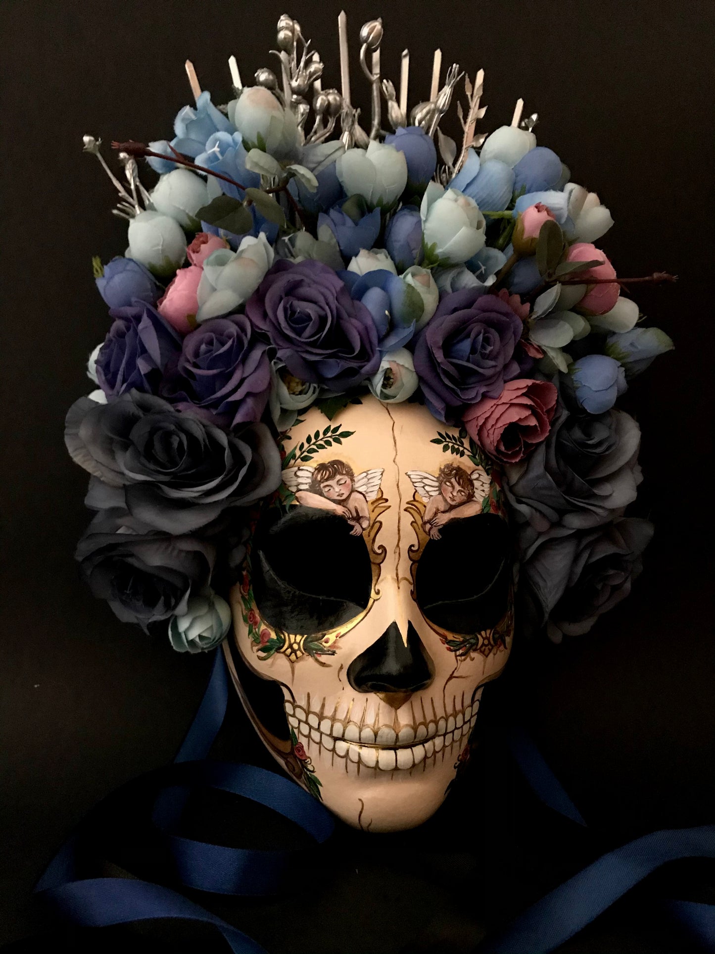 Catrina mask with sleeping angels