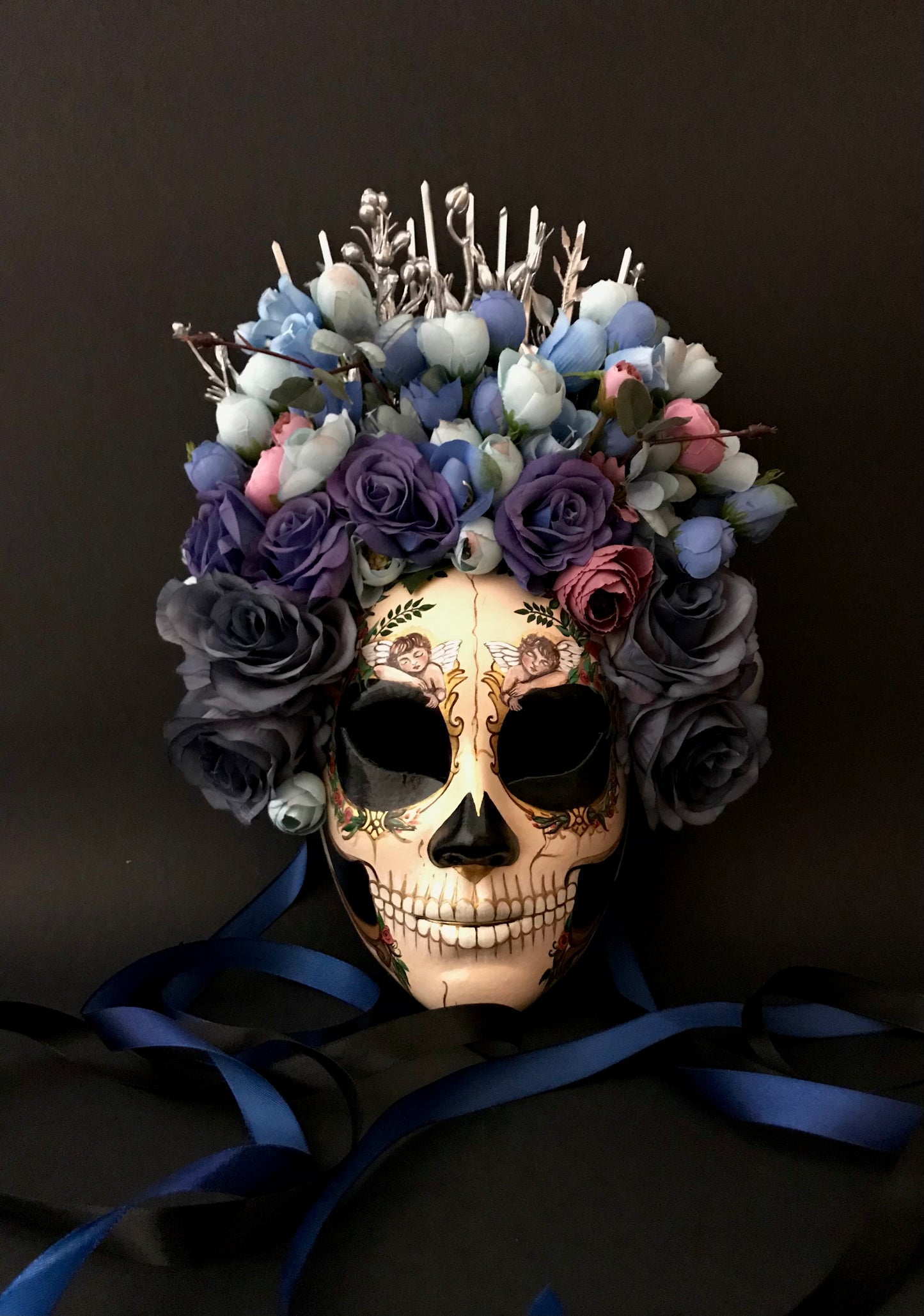Catrina mask with sleeping angels