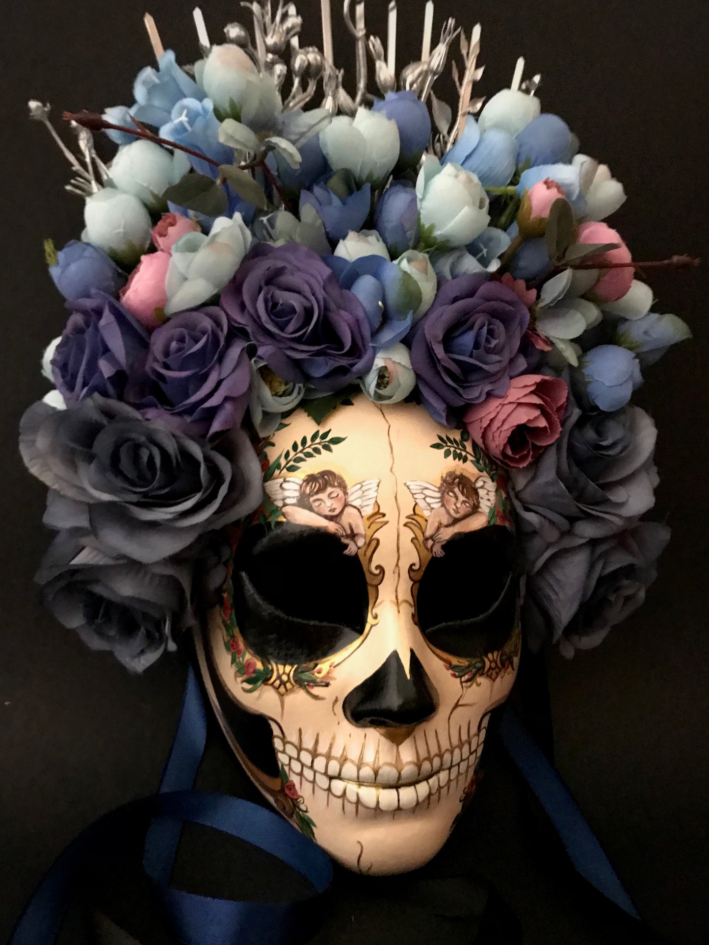 Catrina mask with sleeping angels