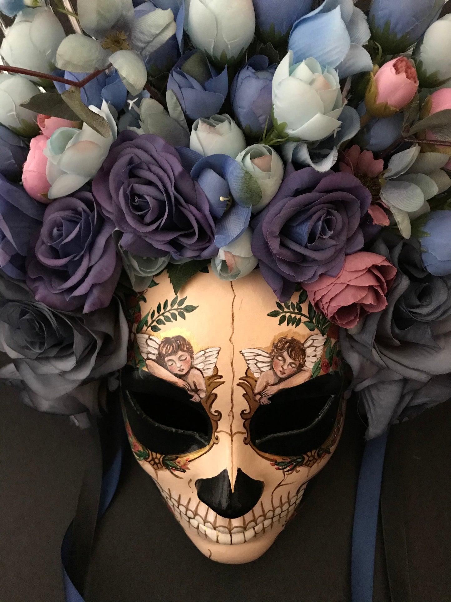 Catrina mask with sleeping angels