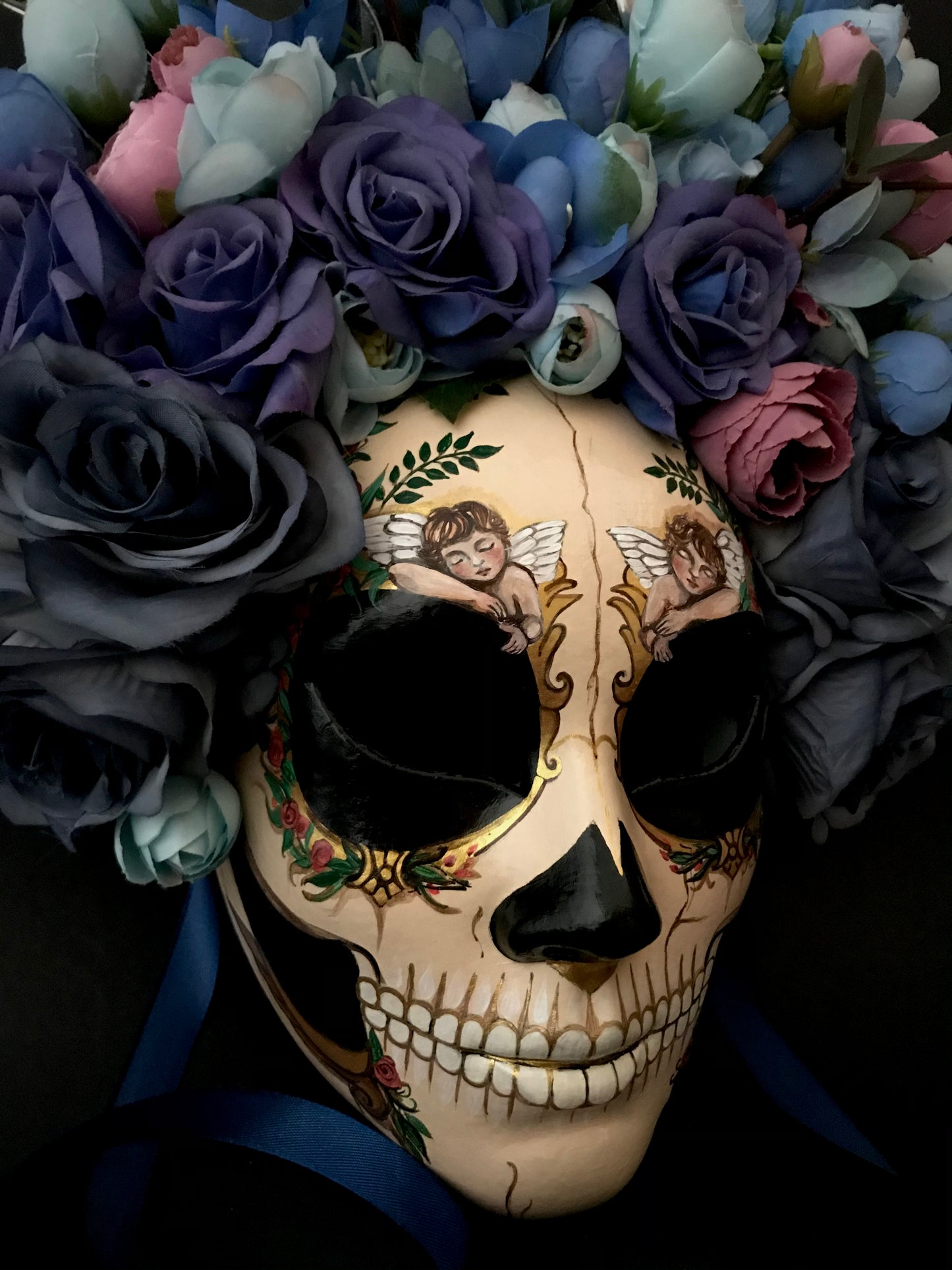 Catrina mask with sleeping angels