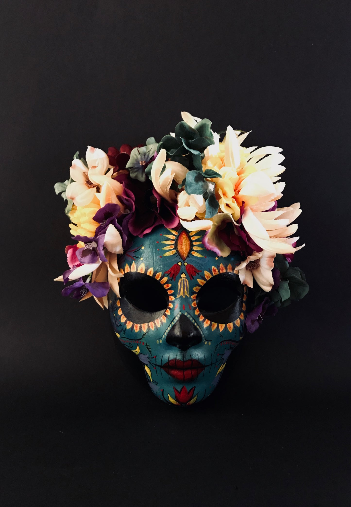 Blue Catrina with colorful flowers