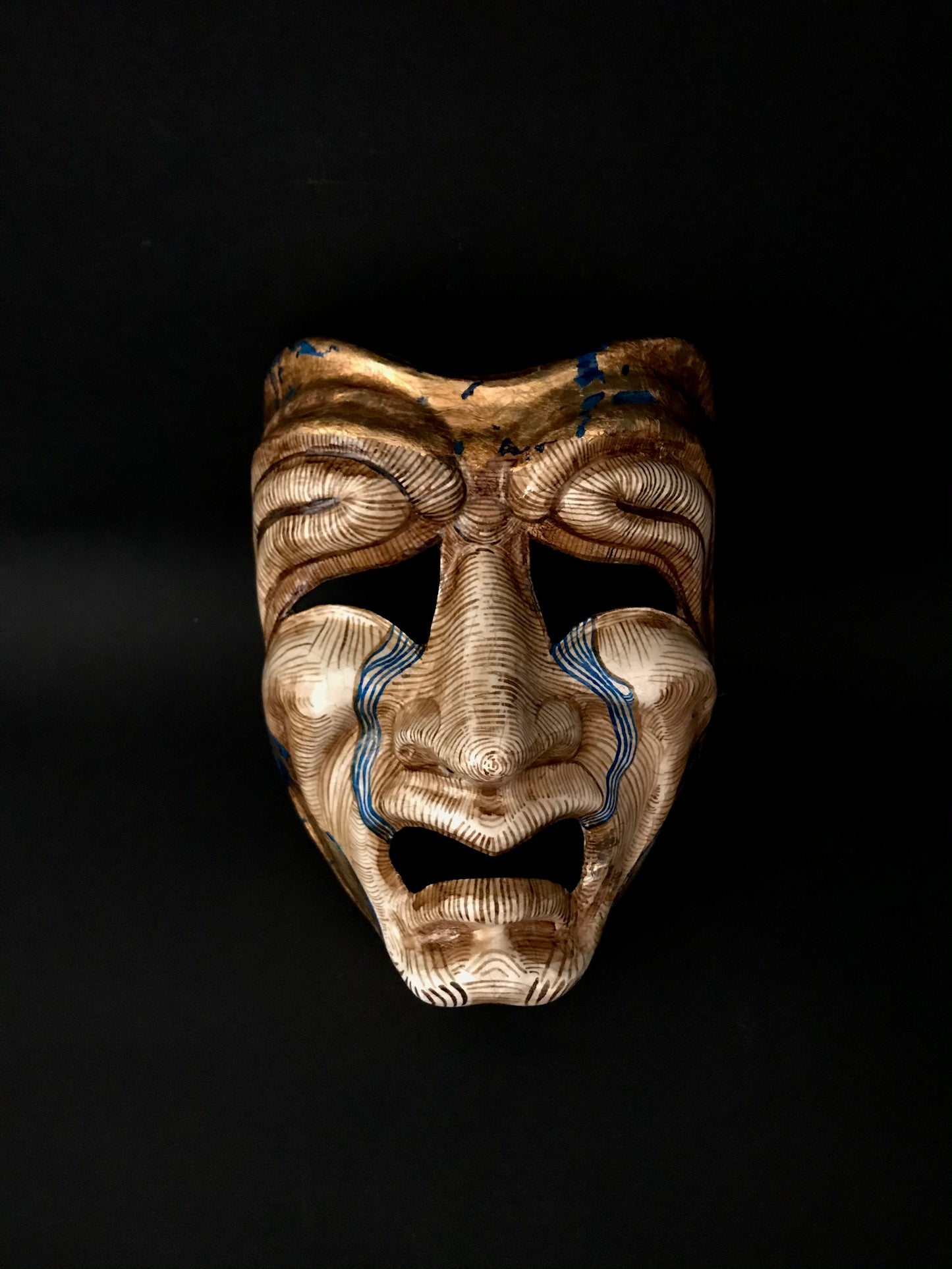 Tragedy mask with gold