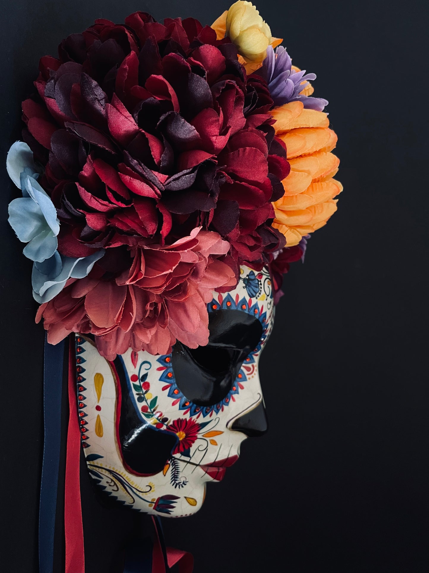 Catrina mask with colored flowers