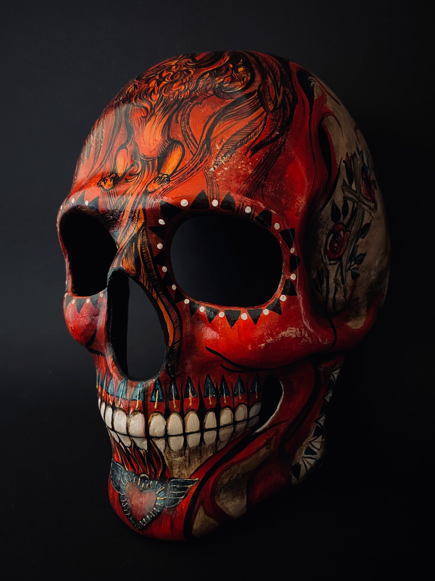 Red skull with phoenix bird. Skull mask.