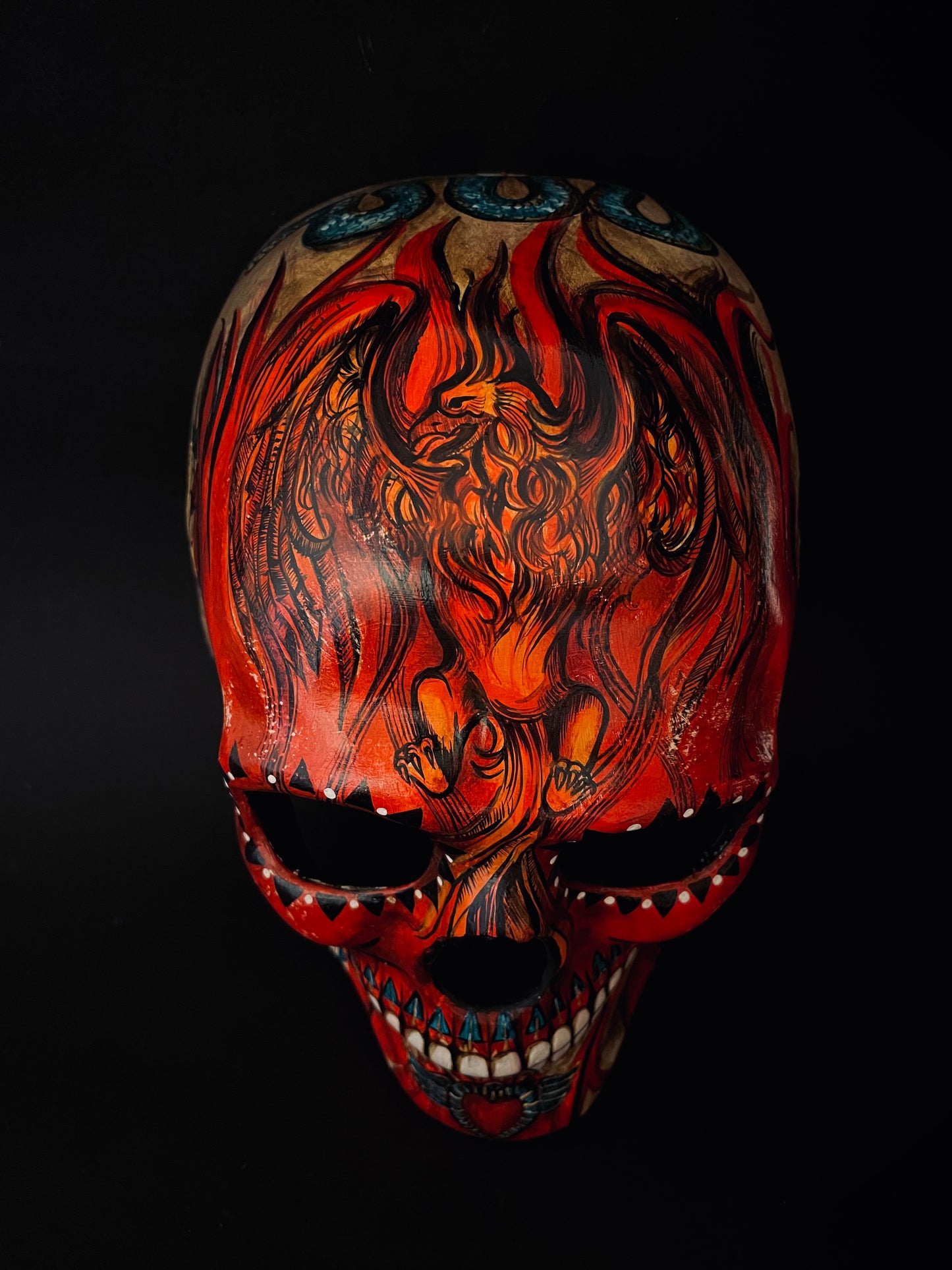 Red skull with phoenix bird. Skull mask.