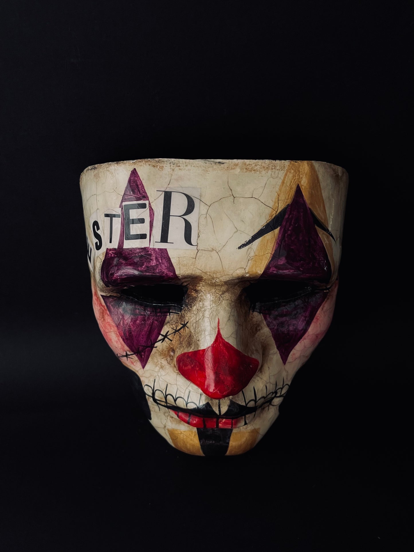 Purple and gold joker mask. Clown mask.