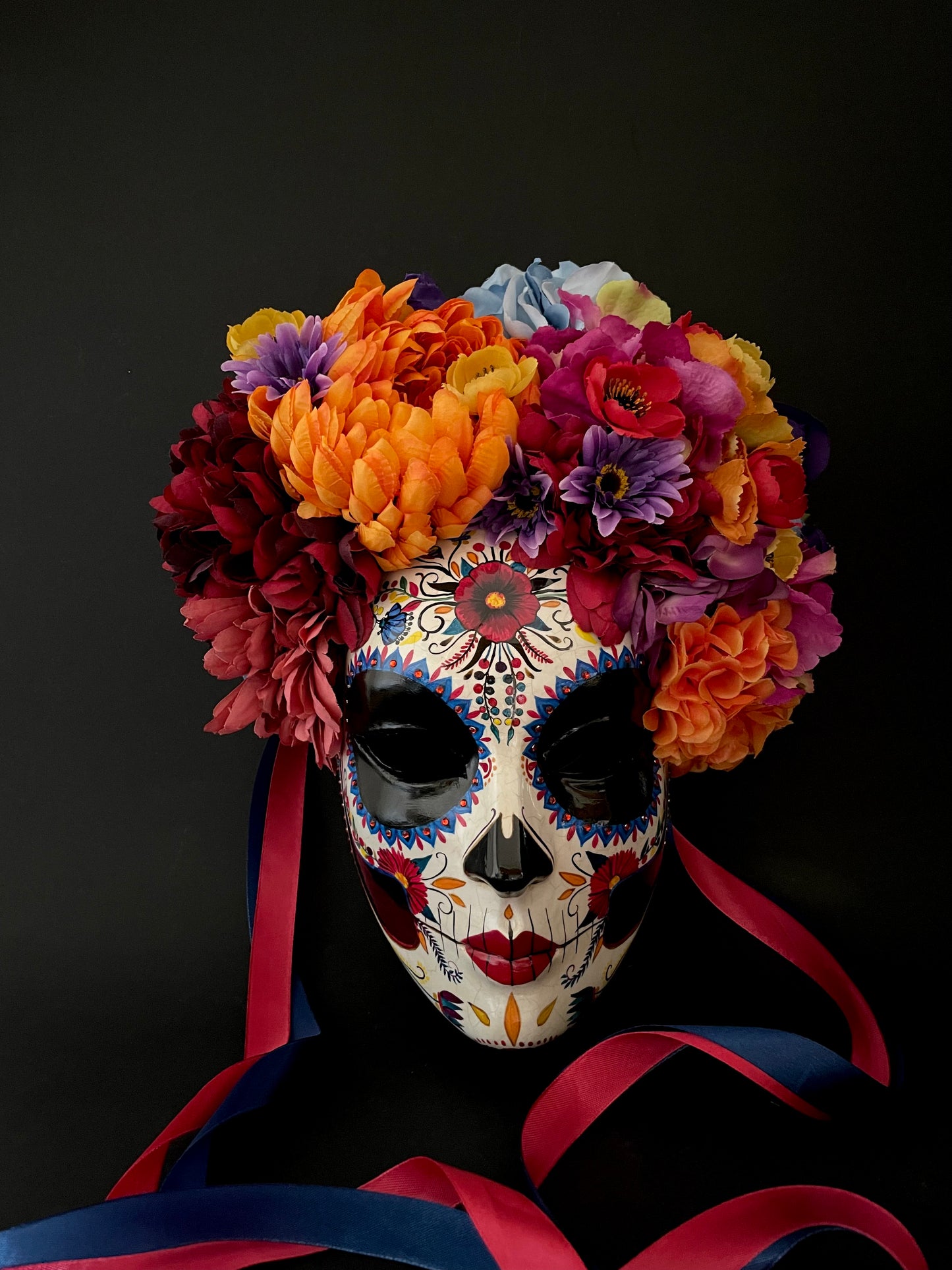 Catrina mask with colored flowers