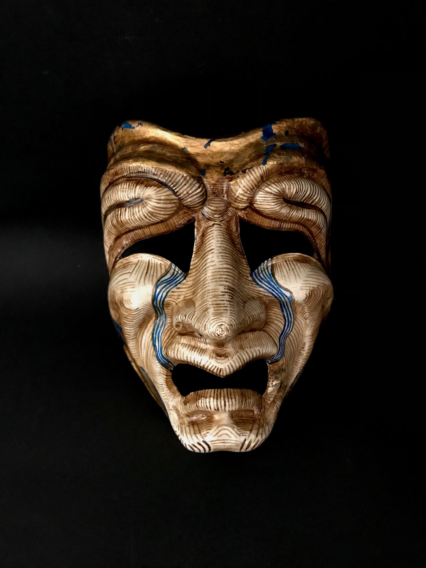 Tragedy mask with gold