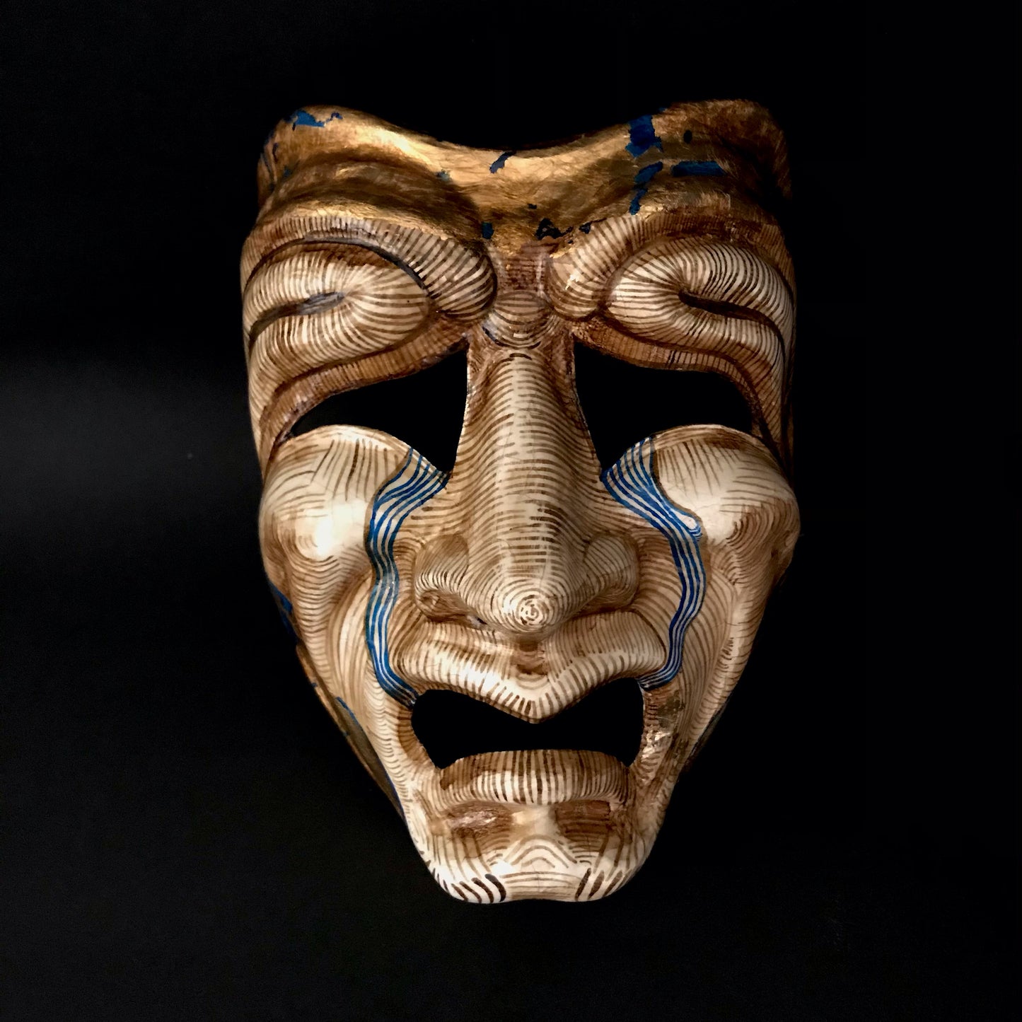 Tragedy mask with gold