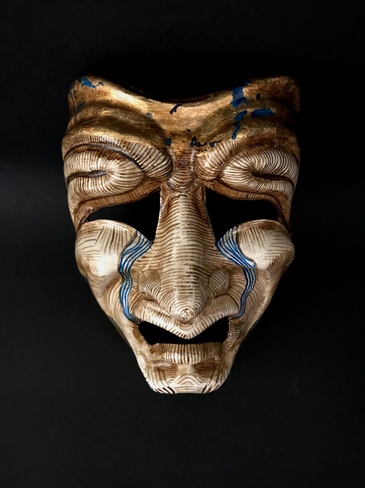 Tragedy mask with gold