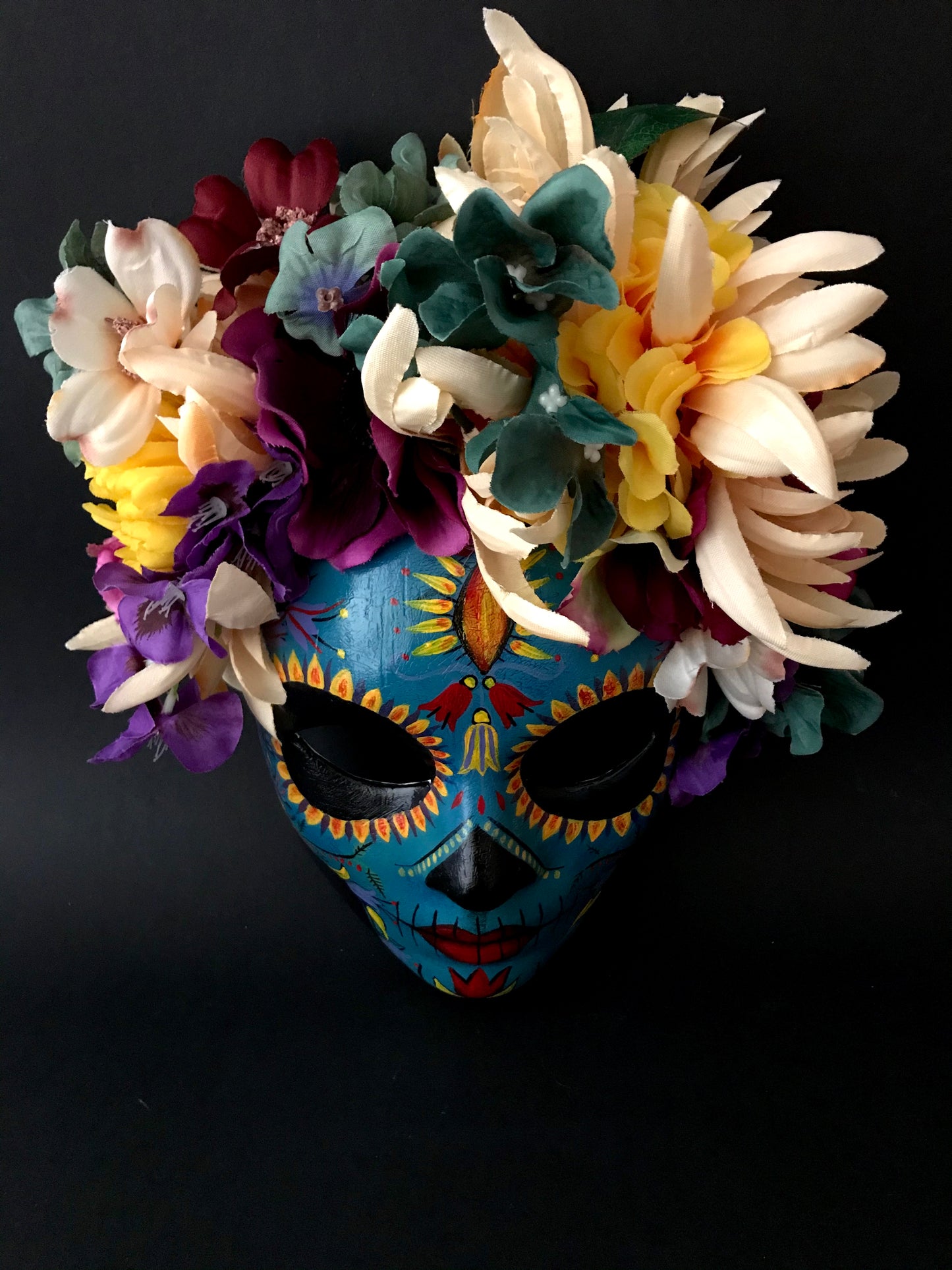 Blue Catrina with colorful flowers