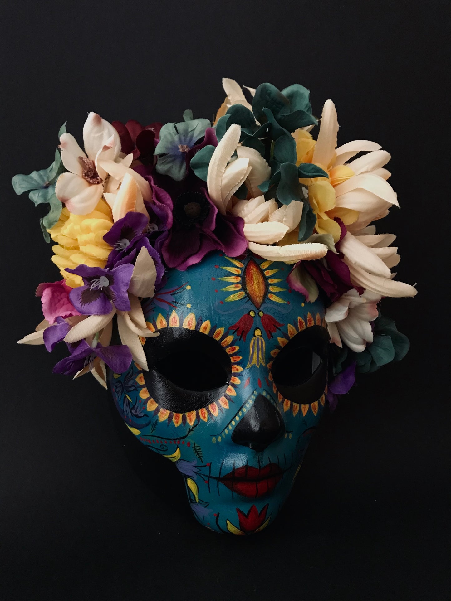 Blue Catrina with colorful flowers