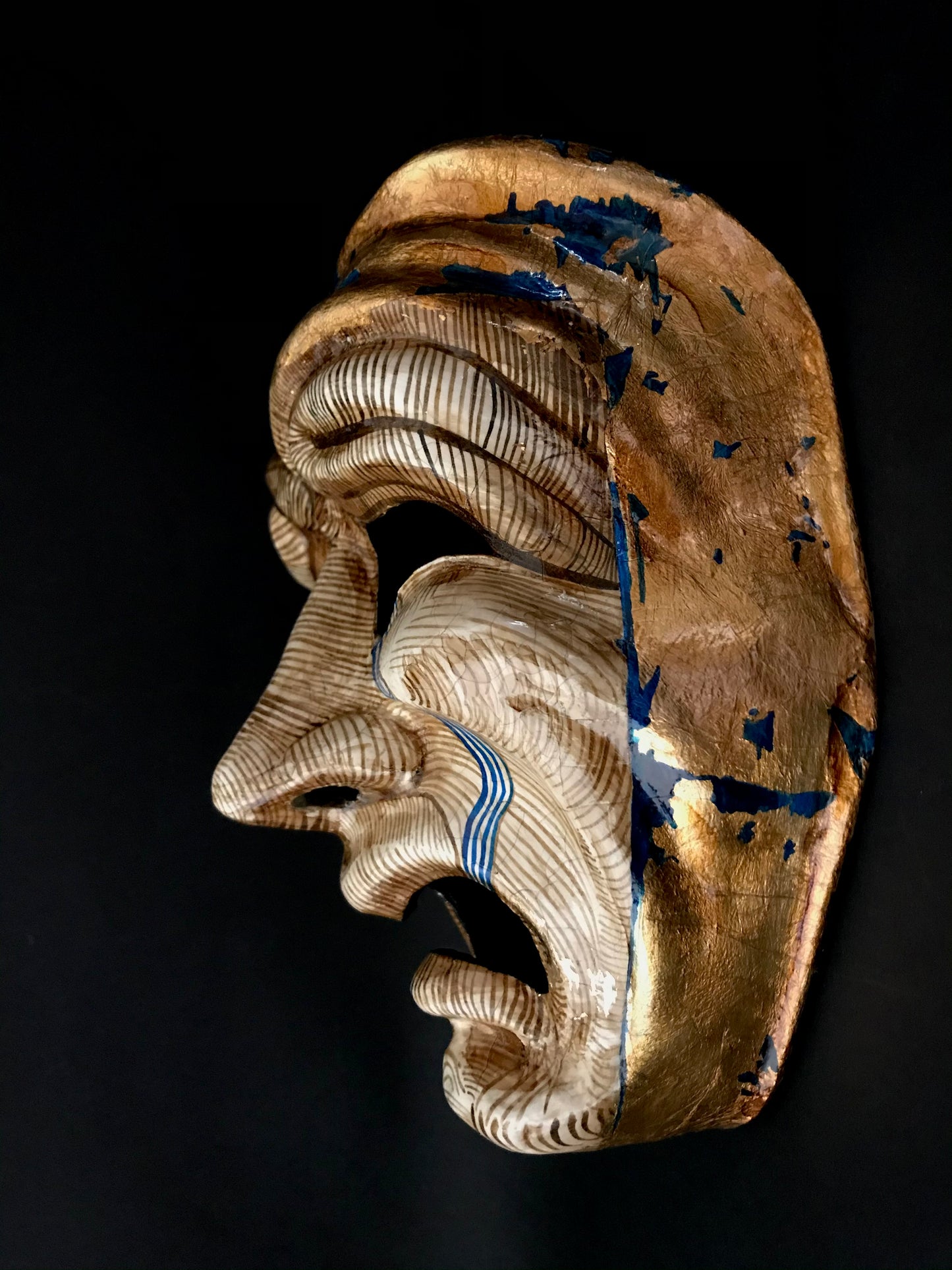 Tragedy mask with gold