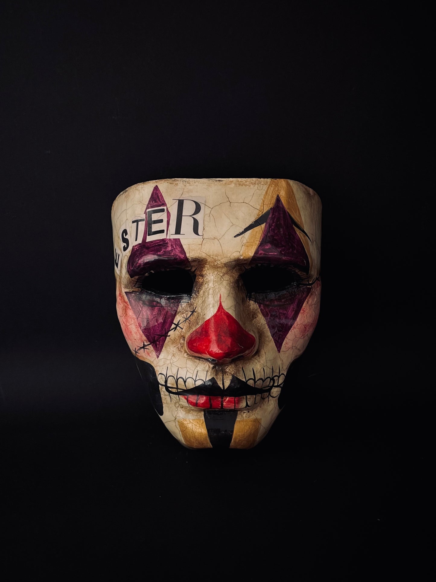 Purple and gold joker mask. Clown mask.