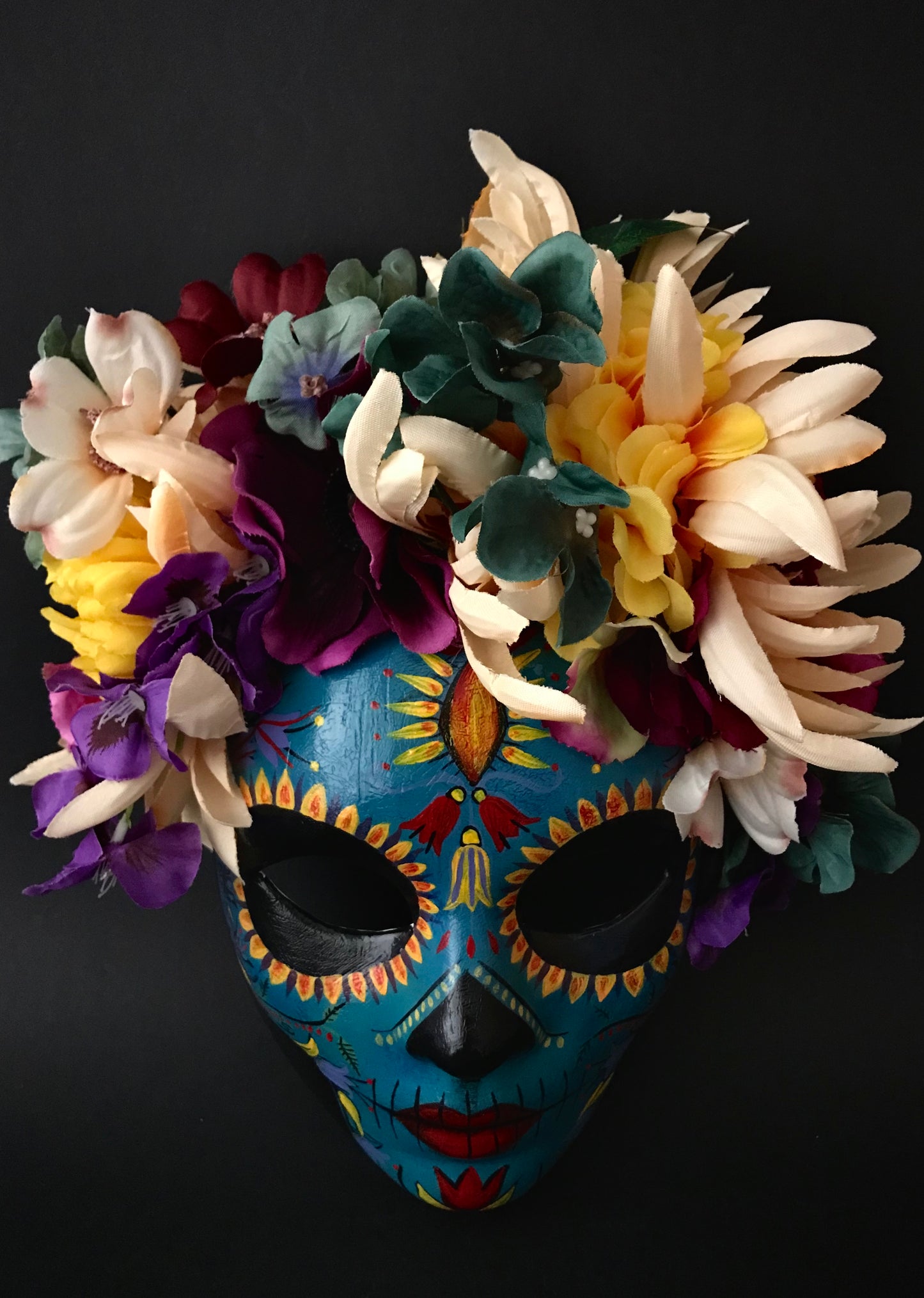 Blue Catrina with colorful flowers