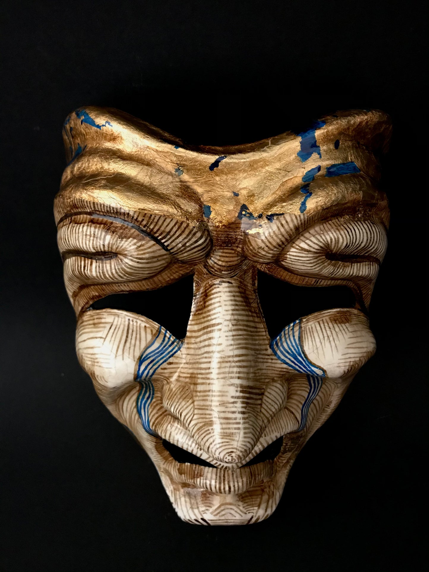 Tragedy mask with gold